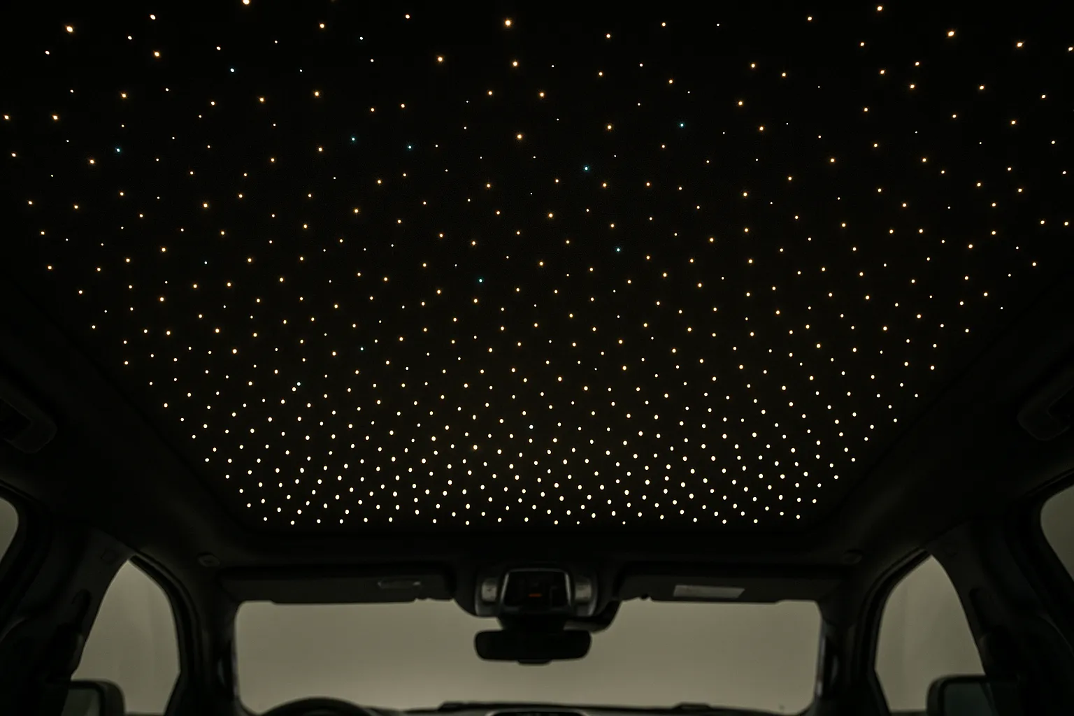 Cabin interior at night with fiber-optic stars across the headliner