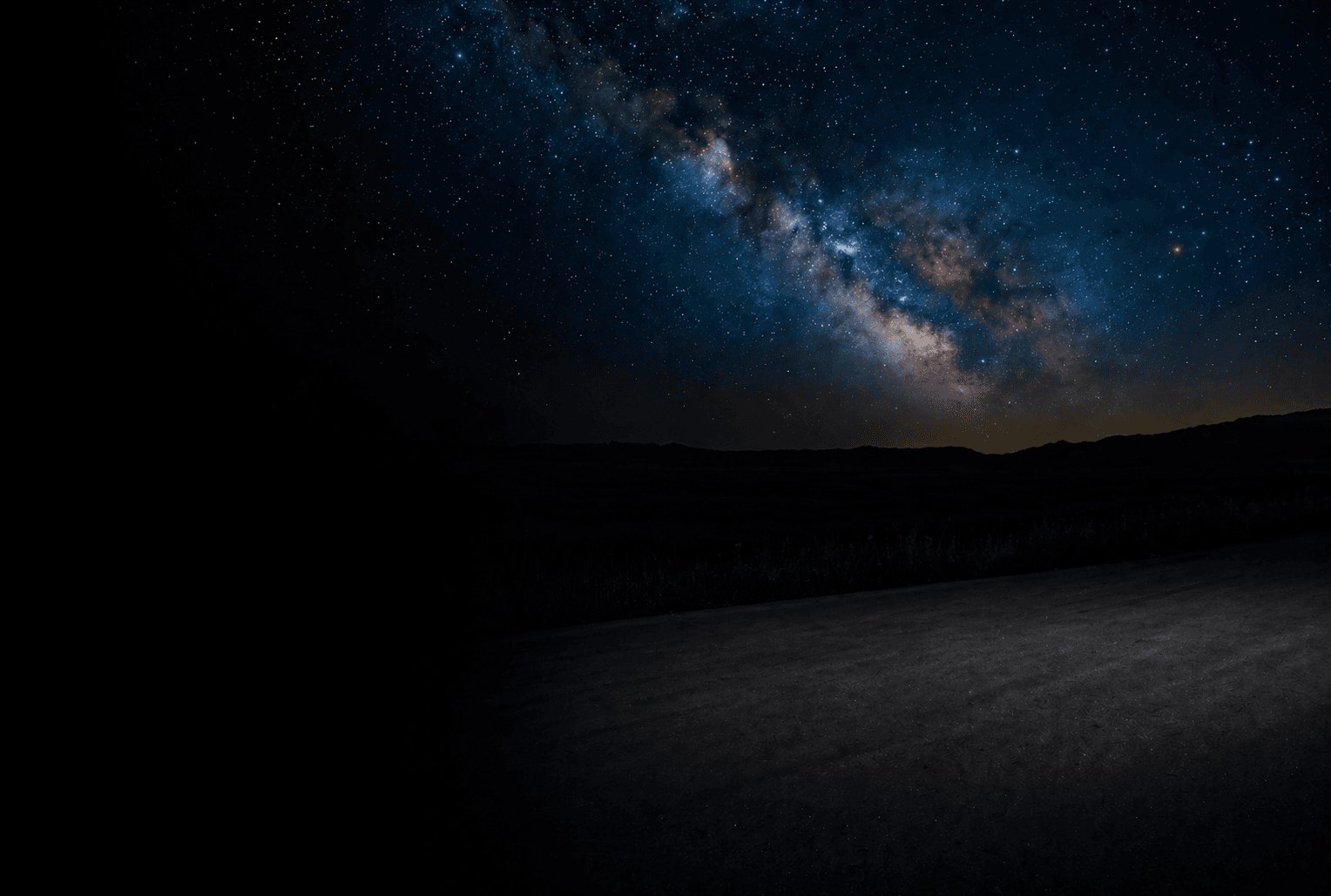 A starfield of cyan points scattered across a dark sky